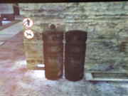 two tubes, one with a knob and one without