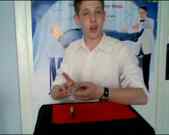 A young man doing card magic, which is what the egg consists of