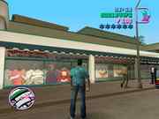 Shop window displaying Grand Theft Auto 3 images