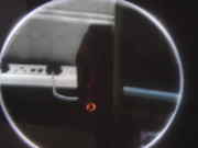 The red ringed xbox on the left of the TV.