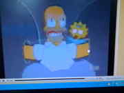 Maggie behind Homer
